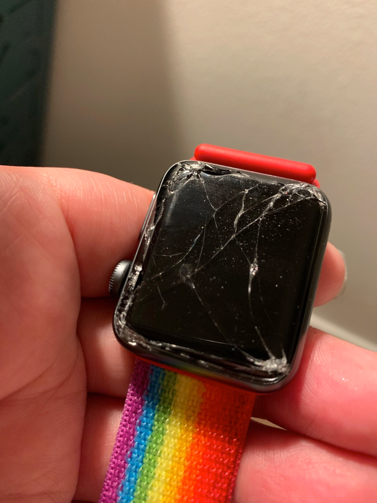 A 38mm Apple Watch with a shattered screen.